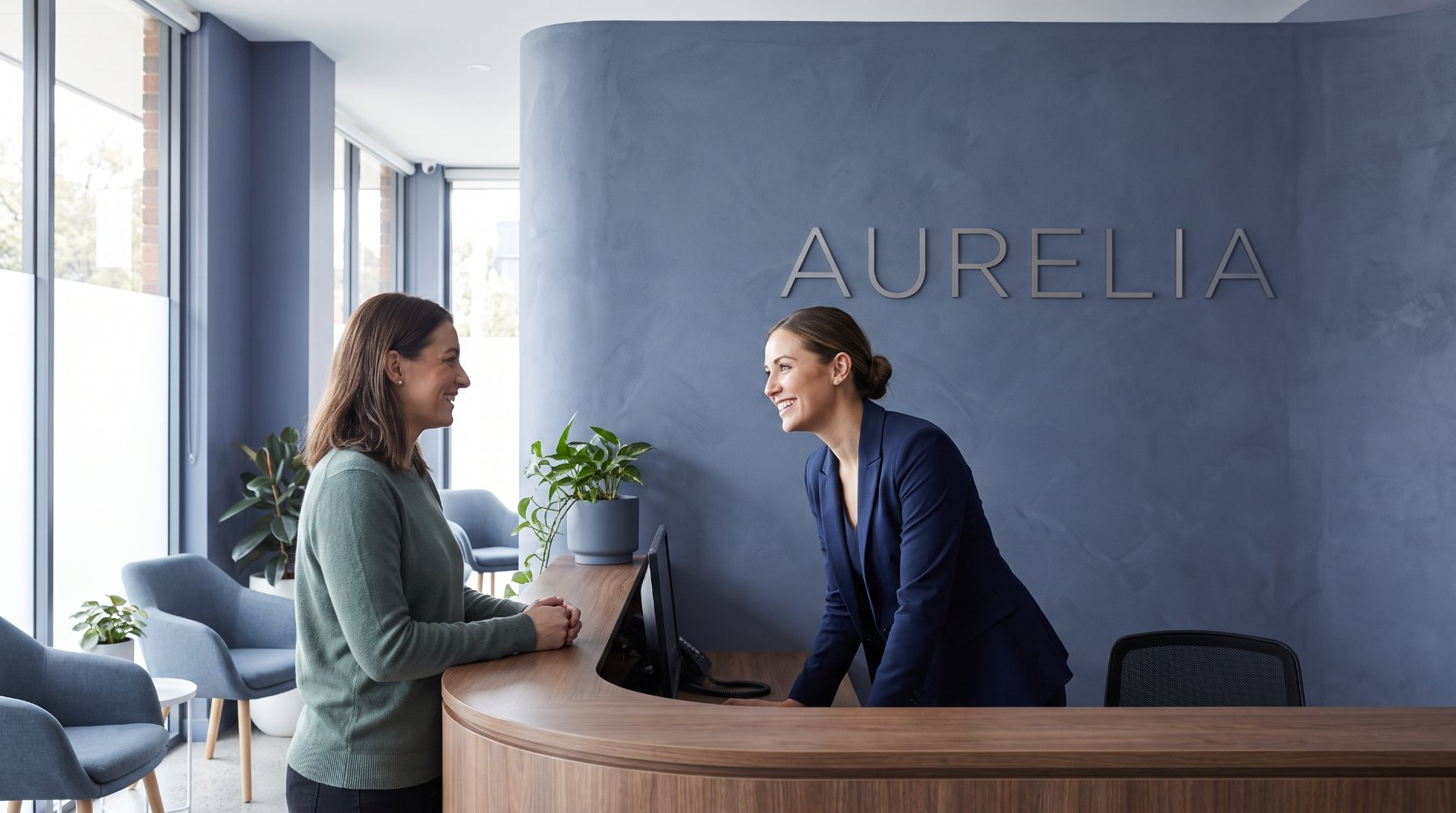 Reception at Aurelia Dental Studio, wordmark on the wall