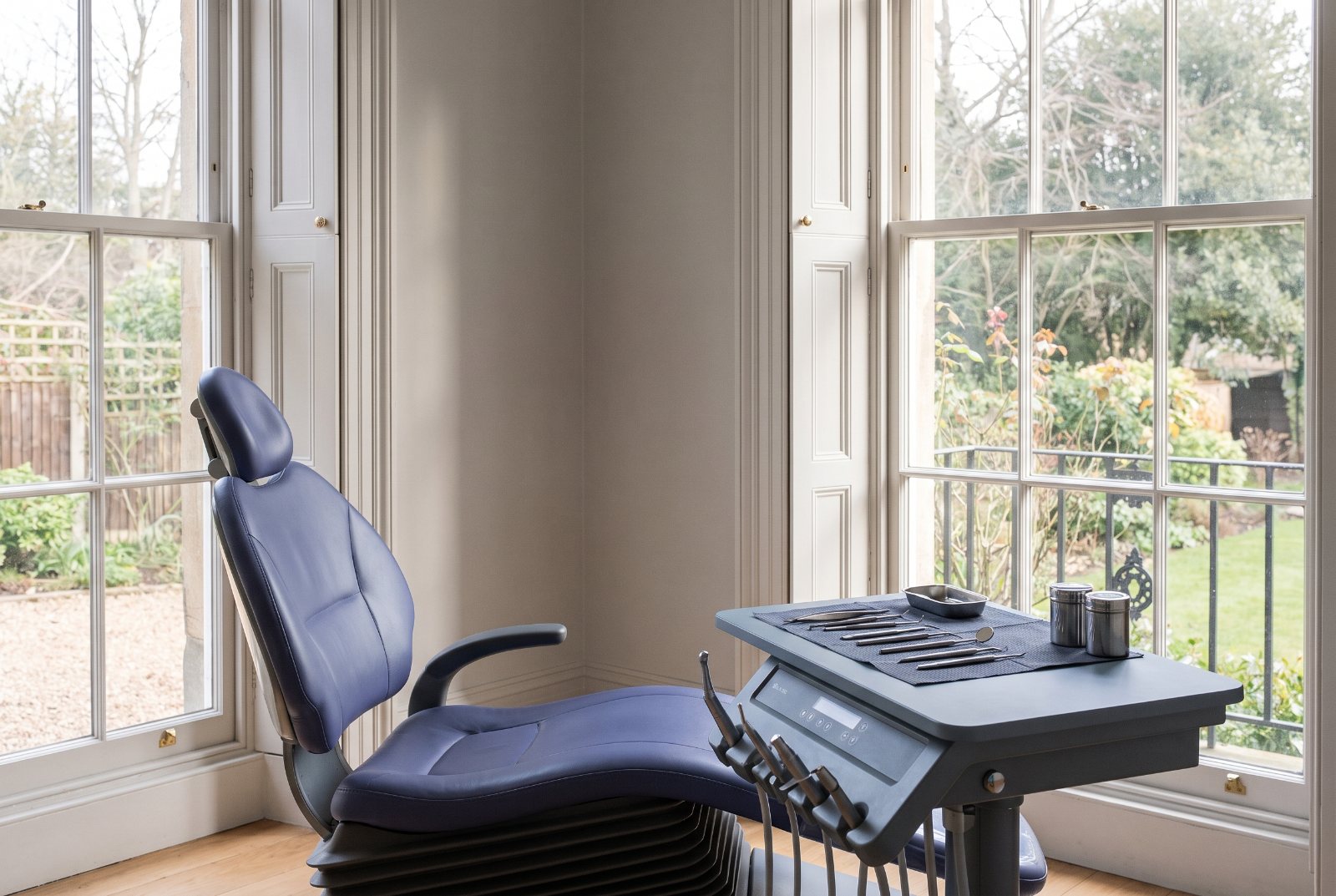 A single treatment room beside the original windows